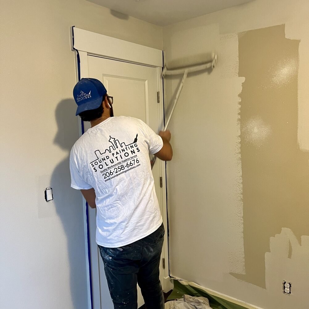 A simple bedroom wall painted in gray/beige