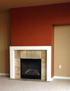 Fireplace accent wall in red by Sound Painting Solutions