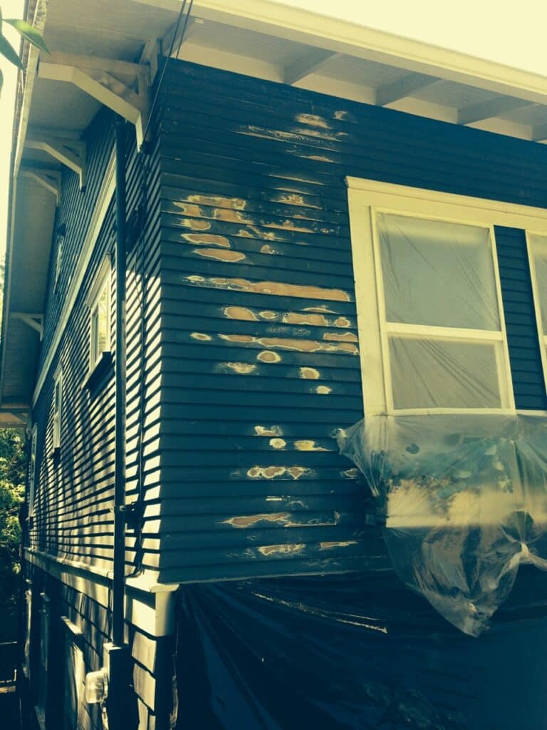 A home that has been scraped but not yet painted. Special preparation was needed due to lead paint.