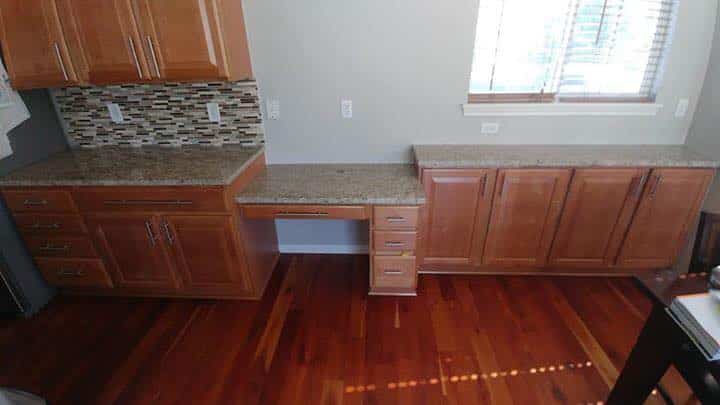 Example cabinet painting project (before painting, the cabinets are the original oak) from Walls by Design