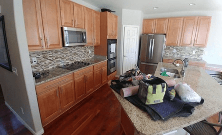 Example cabinet painting project (before painting, the cabinets are the original oak) from Walls by Design