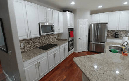 Example cabinet painting project (finished product - the cabinets are now a bright white) from Walls by Design