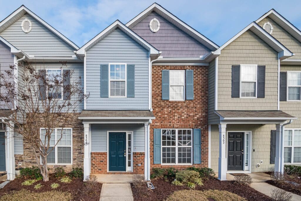 A photo of townhomes in various colors by Curtis Adams from Pixels