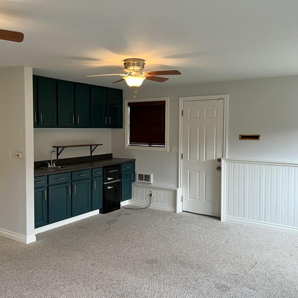 Basement living room area after painting. 