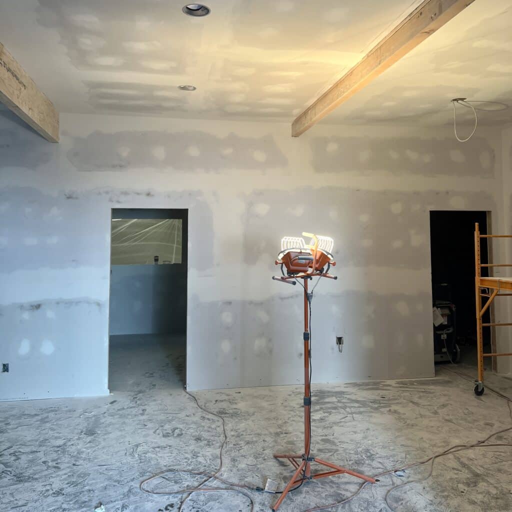 Process of wall sanding during the renovation