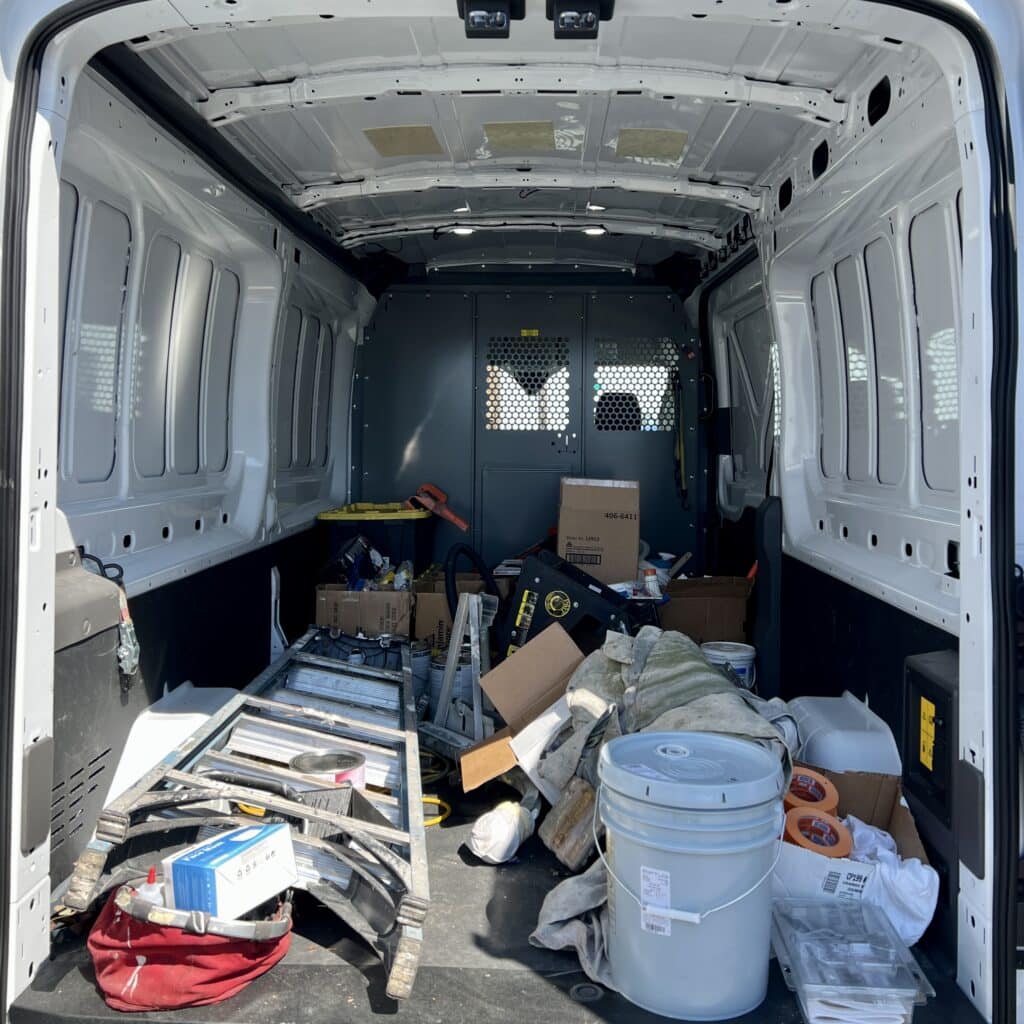 Inside storage area of the painting company van.