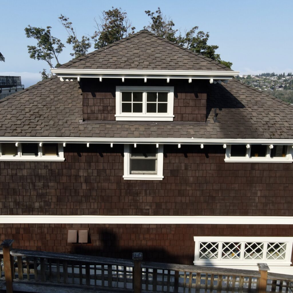 Exterior of the house after the body was stained and trim was painted. 