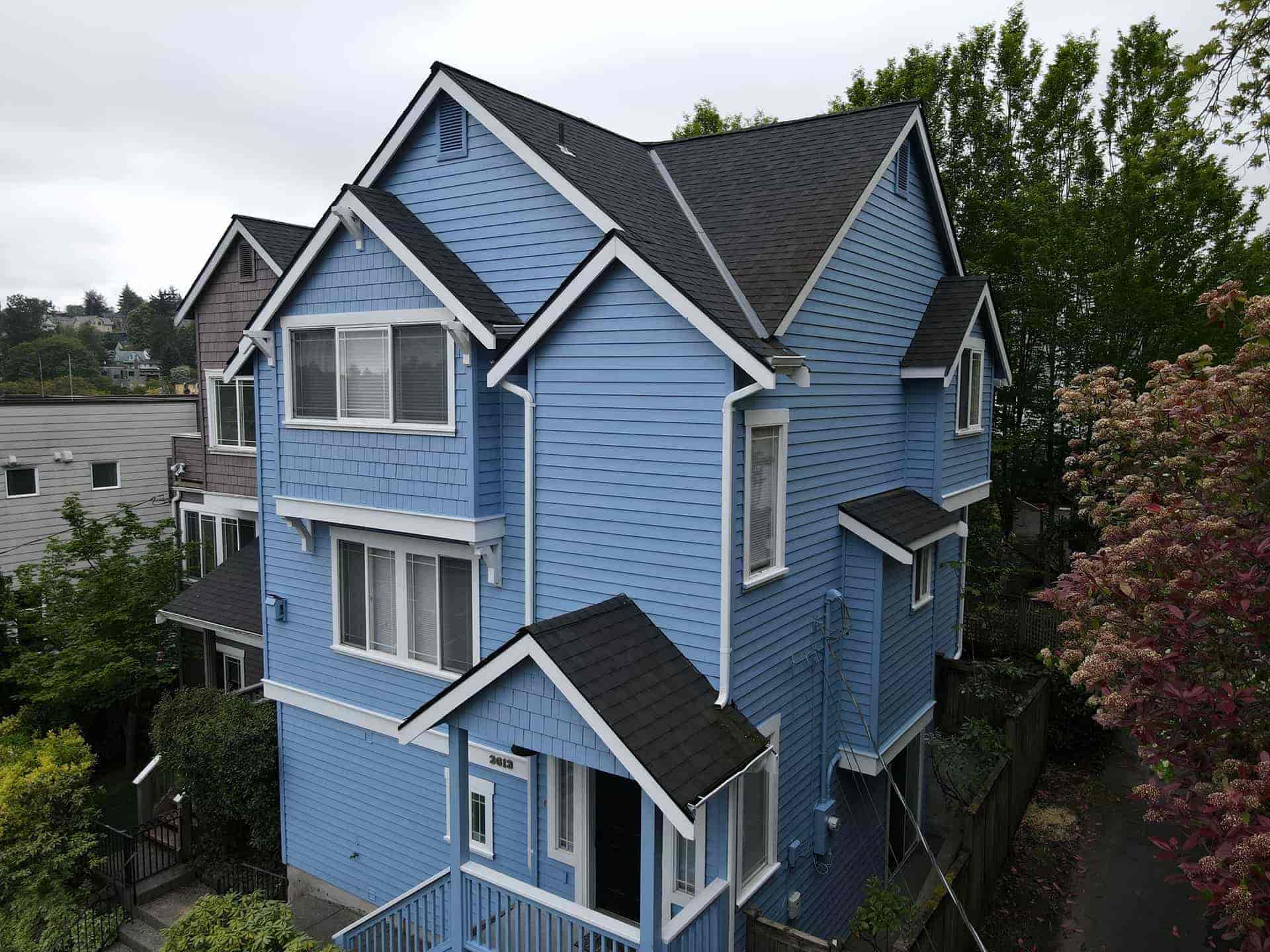 A vibrant blue exterior painting job in Seattle completed by Sound Painting Solutions